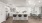 a kitchen with white cabinets and a white table