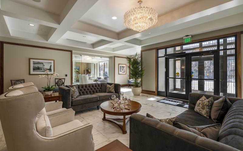 the main entry area with a chandelier and couches
