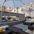 a patio with a couch and a table and chairs