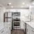 a kitchen with white cabinets