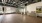 a gym with a wood floor and a painting on the wall
