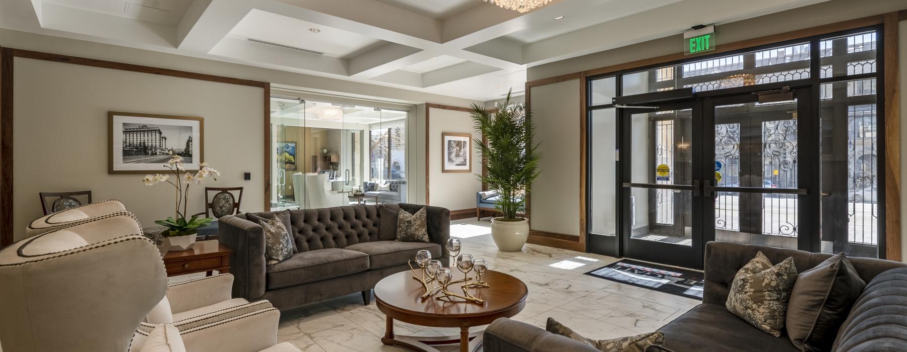the main entry area with a chandelier and couches