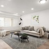a living room with a rug and a rug